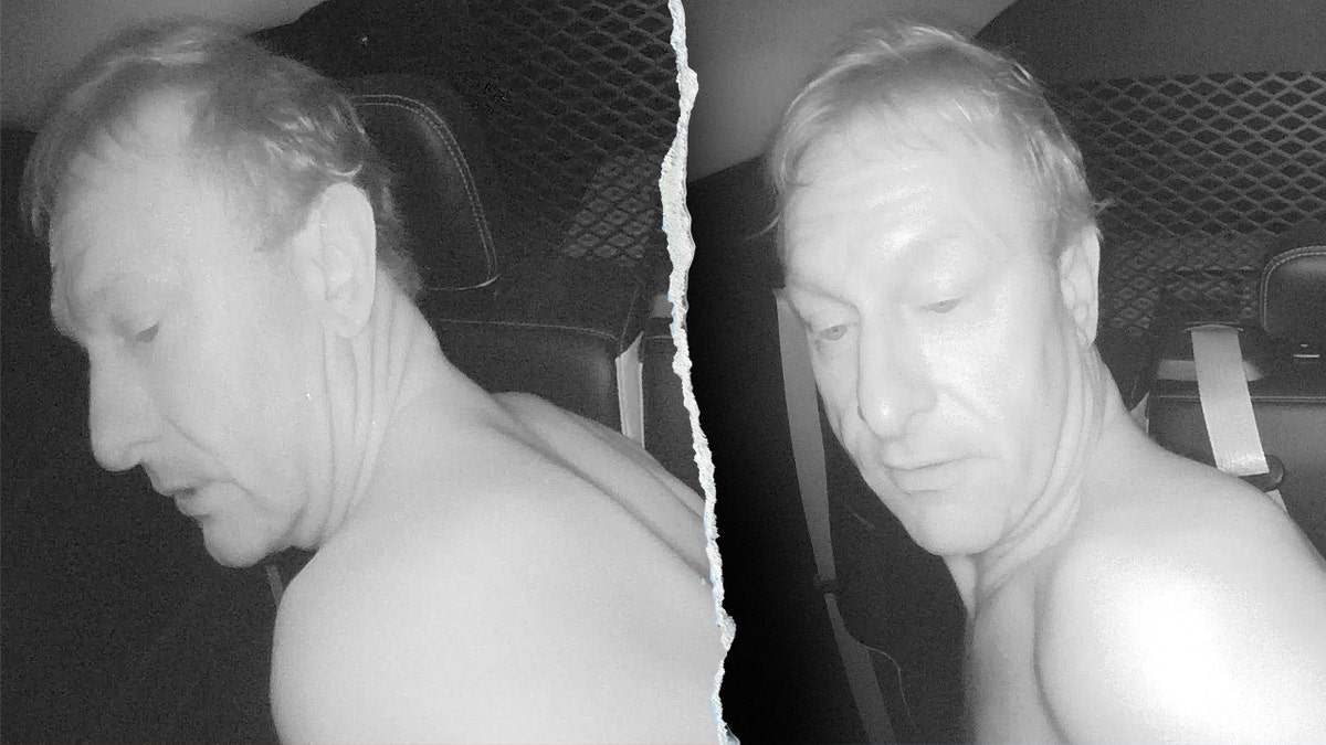 William Mullins McLeod in the back of a police cruiser in May.