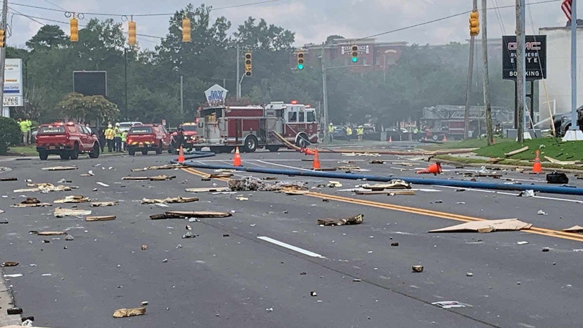 Debris is seen scattered across New Centre Drive in Wilmington, N.C., after a gas leak resulted in a building explosion on Aug. 19, 2025.