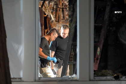 Couple found tied up and burned to death in home near famous racetrack as police hunt for suspect