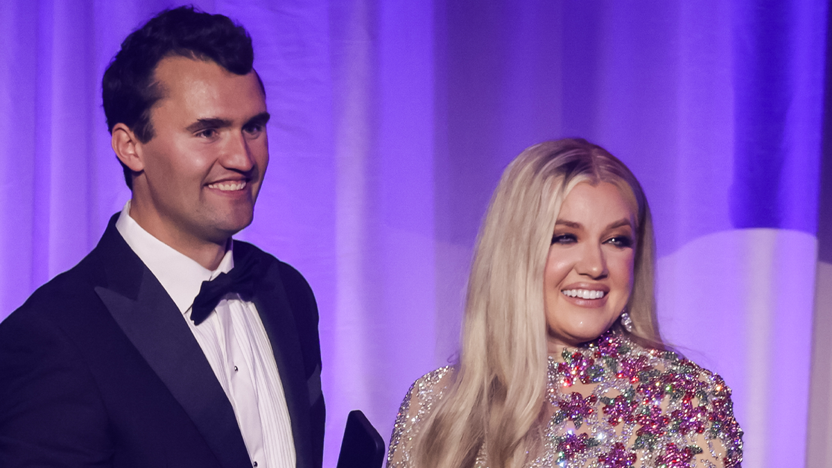 Charlie Kirk smiling next to his wife