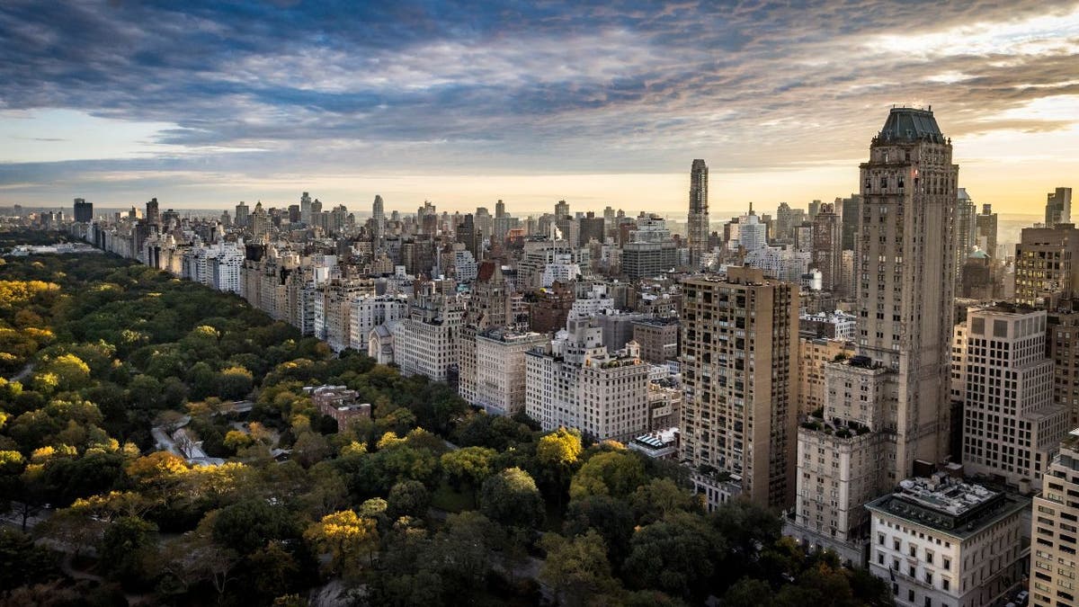 Manhattan skyline with Central Park in the foreground on a fall morning.