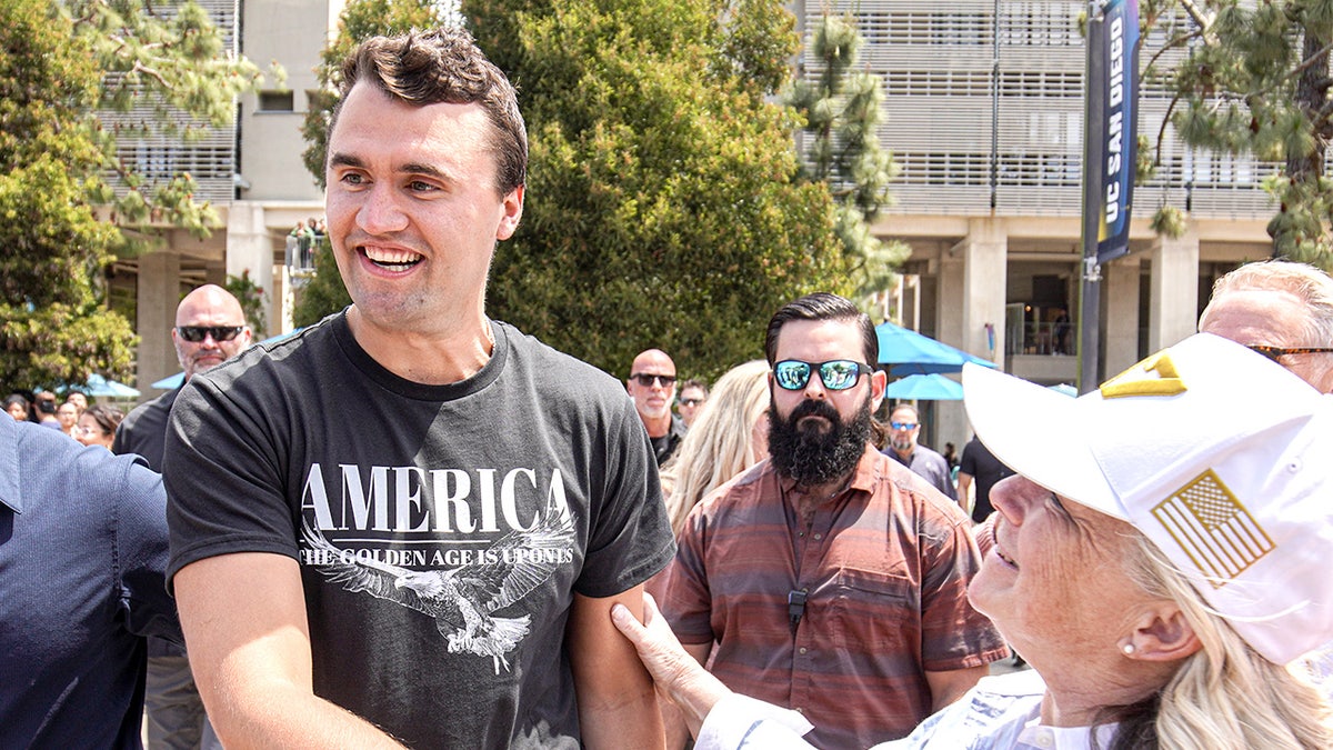 Charlie Kirk greets supporters