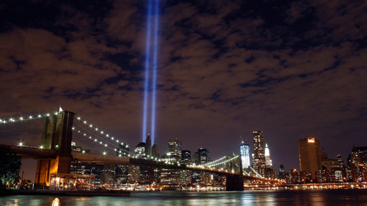 Sept 10: The Tribute in Light rises over the Brooklyn Bridge and lower Manhattan.