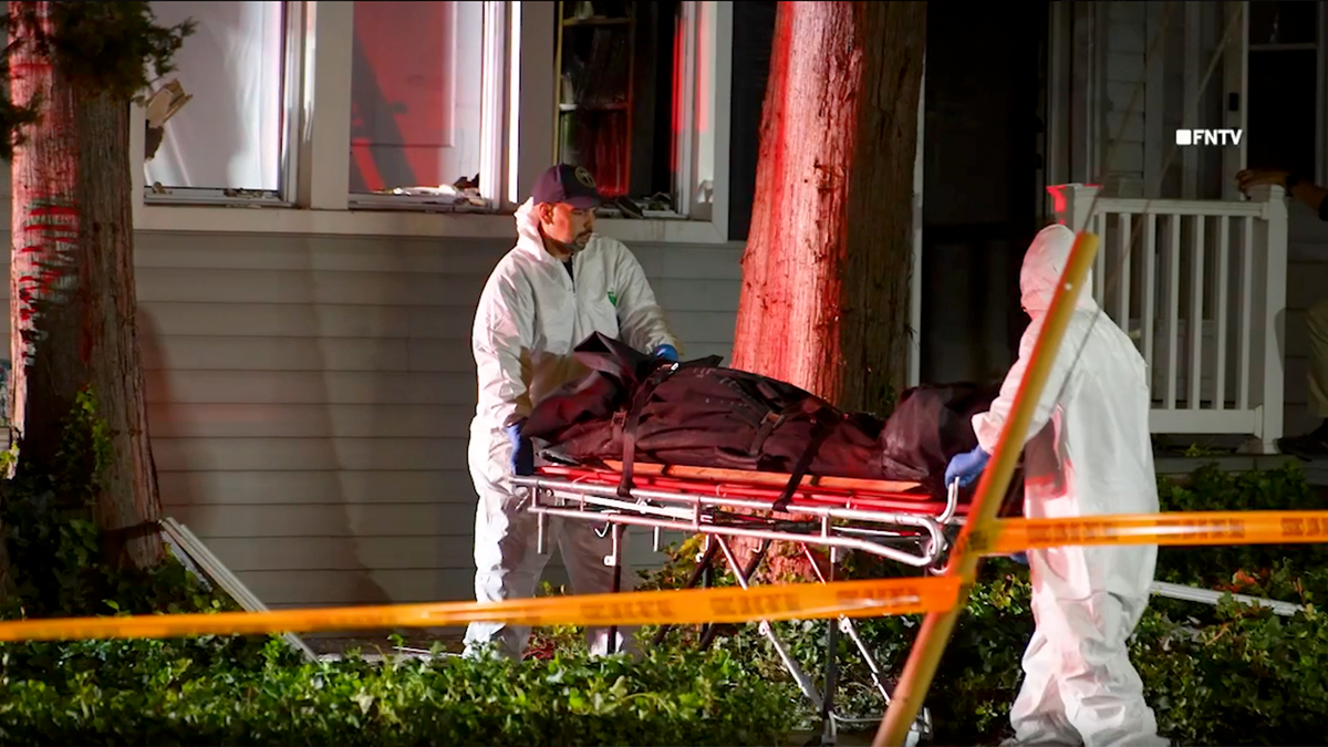 a still image taken from video shows paramedics removing one of the victims on a stretcher