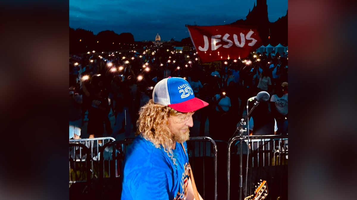 Worship leader Sean Feucht performs during HUD’s first faith-based disaster recovery event on the National Mall.