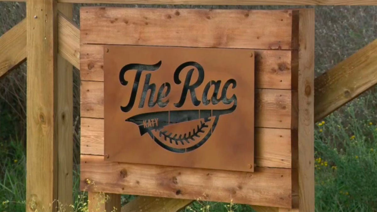 Wooden sign for The Rac baseball field