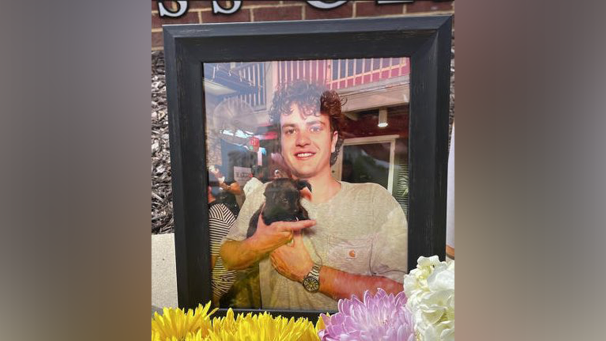 Nate Baker holding a dog in a photo