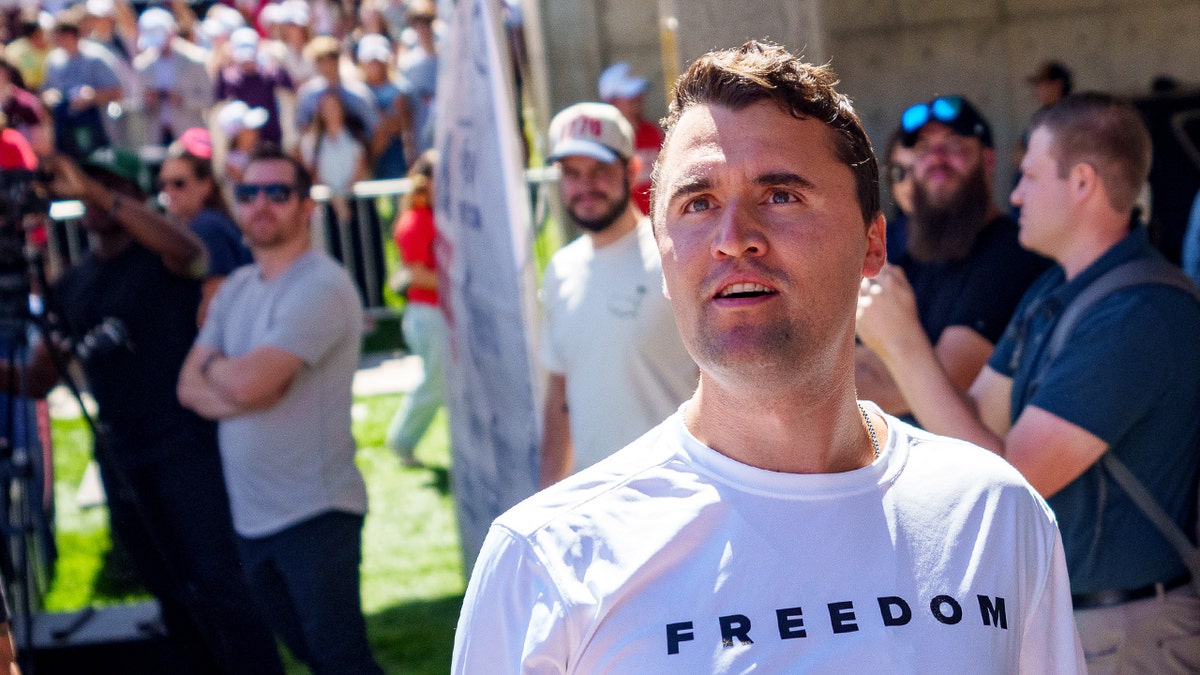 Charlie Kirk looks into the crowd at a Utah event.