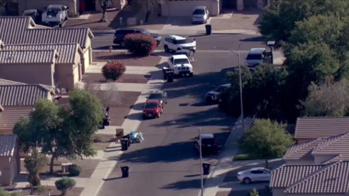 Federal agents surround a home in Avondale