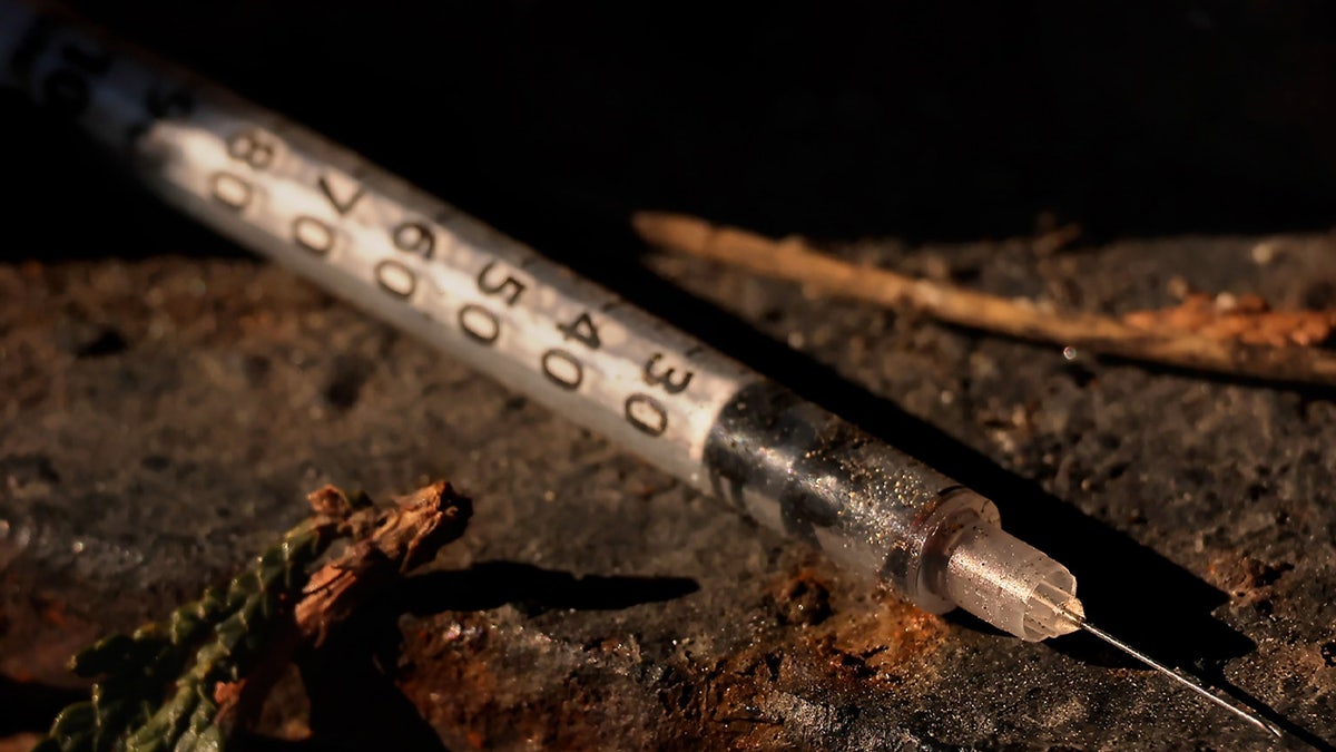 A discarded syringe litters the ground near Mass and Cass