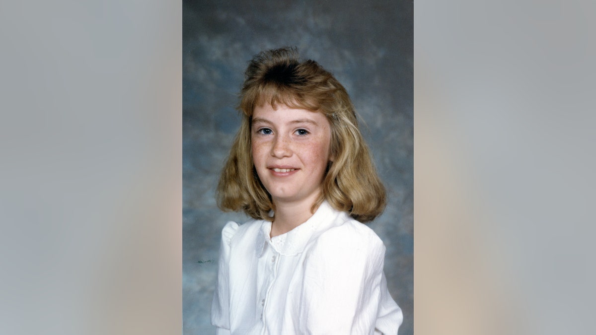 A school photo of Rebecca Lafferty as she wears white.