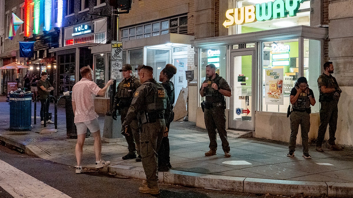 FBI and Border Patrol officers speak with Sean Charles Dunn,