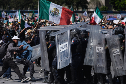 Protesters attack police, breach barrier at Mexico’s National Palace during rally against cartel violence