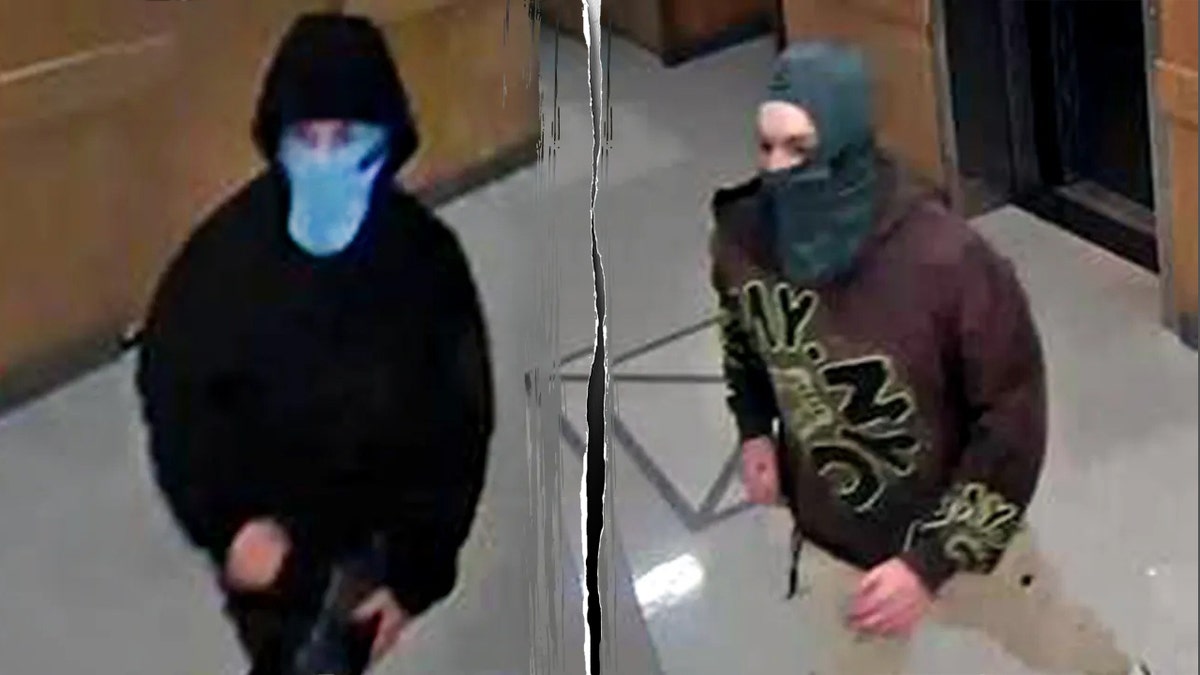 A surveillance image of one suspect in a light blue face covering and black hoodie split with a surveillance image of a second of a masked suspect in a hood covering and brown sweatshirt