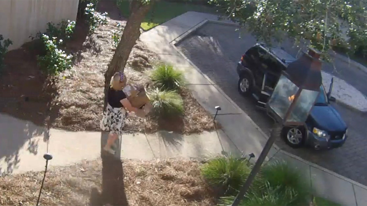 Surveillance footage shows Todd Bond allegedly carrying stolen packages to his car