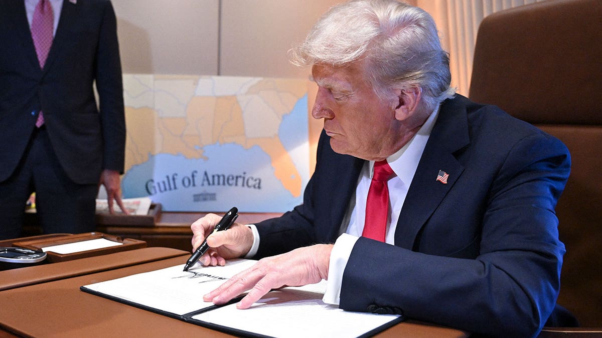 US President Donald Trump signs a proclamation renaming the Gulf of Mexico as the Gulf of America aboard Air Force One, enroute to New Orleans, Louisiana on Febrary 09, 2025.