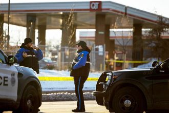 Omaha bystander flees gas station bathroom moments before armed man fires on officers