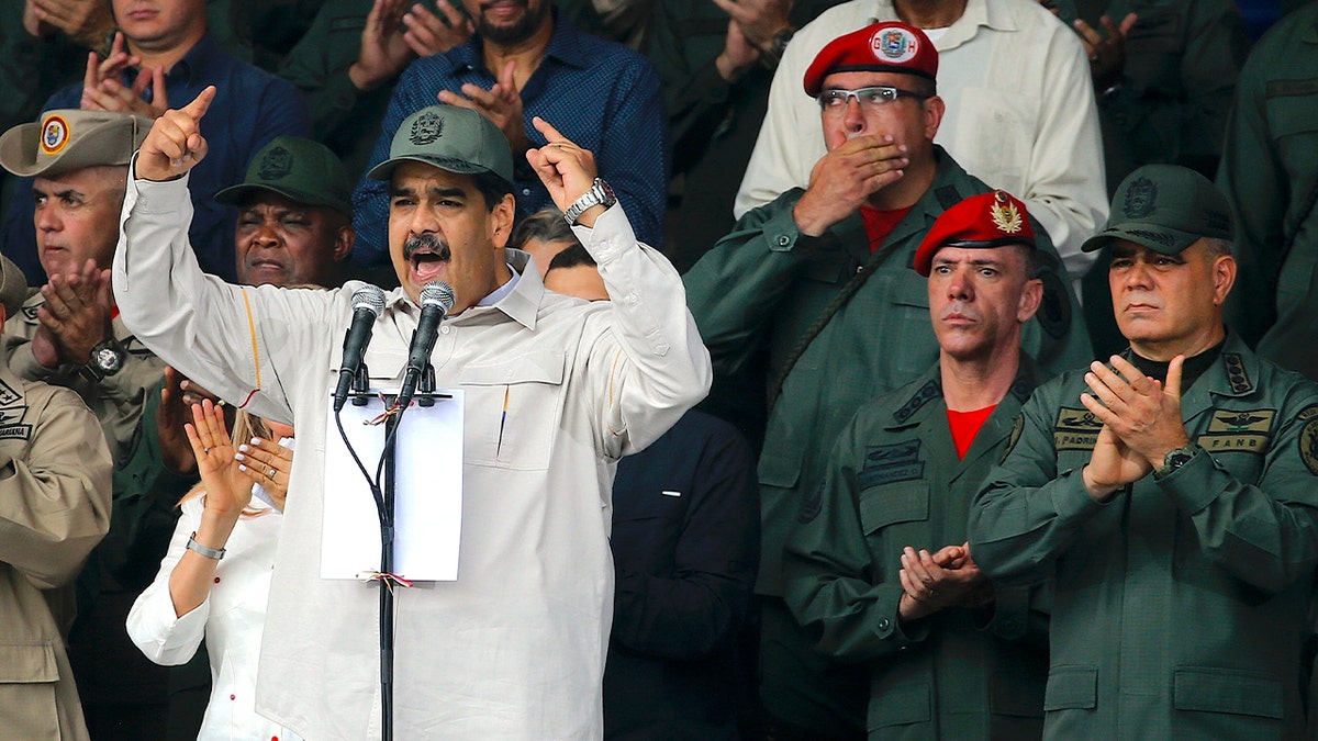 In this April 13, 2019 file photo, Venezuela's President Nicolas Maduro, speaks flanked by Defense Minister Vladimir Padrino Lopez, right, and Gen. Ivan Hernandez, second from right, head of both the presidential guard and military counterintelligence in Caracas, Venezuela.