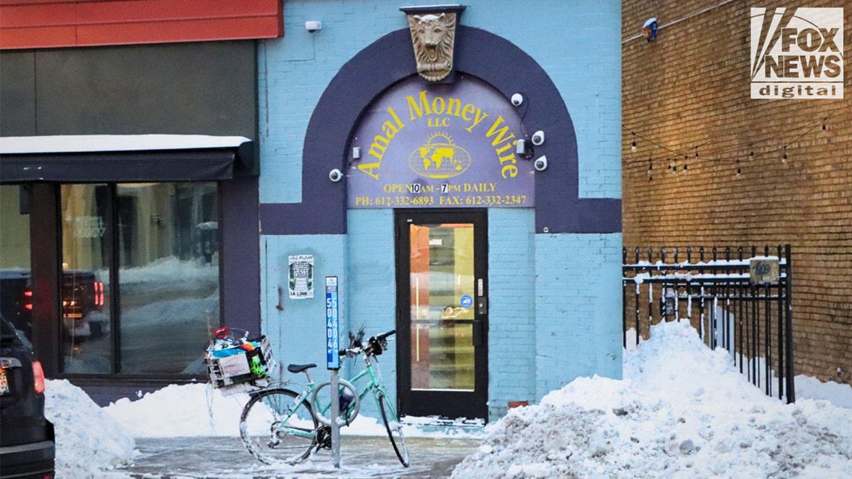 Amal Money Wire storefront on a snowy winter morning in Minneapolis.