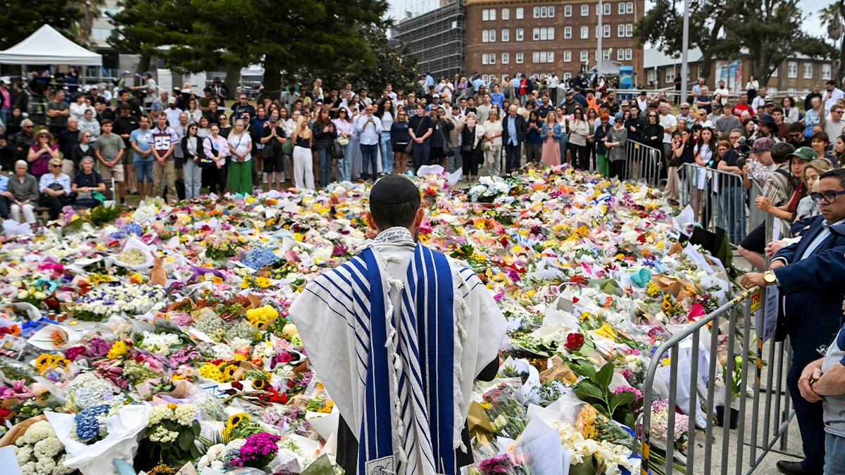 People attend a memorial for the victims of the Bondi Beach Hanukkah attack