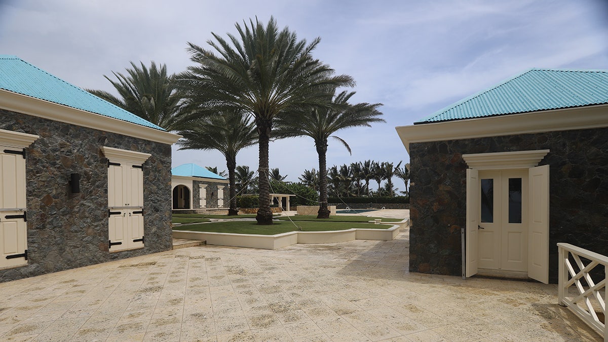 Buildings shown outdoors at Epstein's island