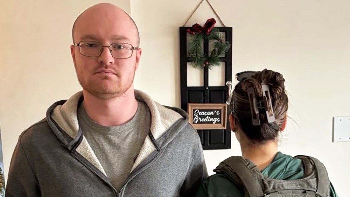 Logan Murfin being arrested