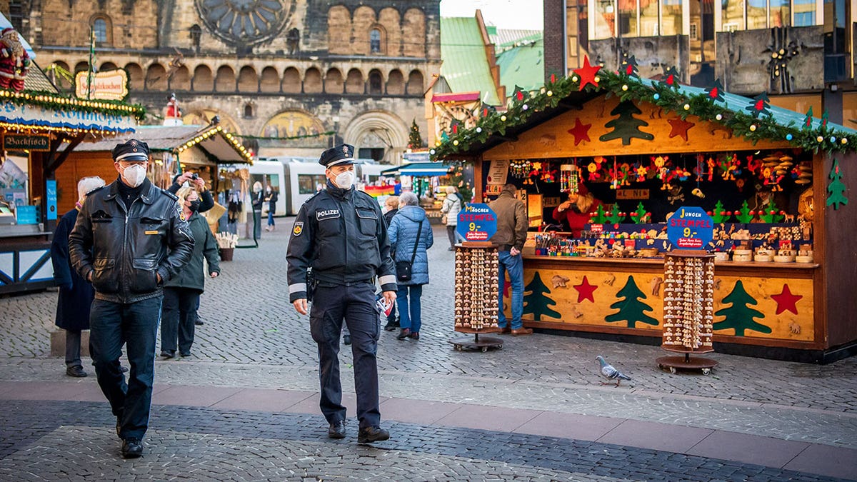 Police officers patrol the annual Christmas market in Germany