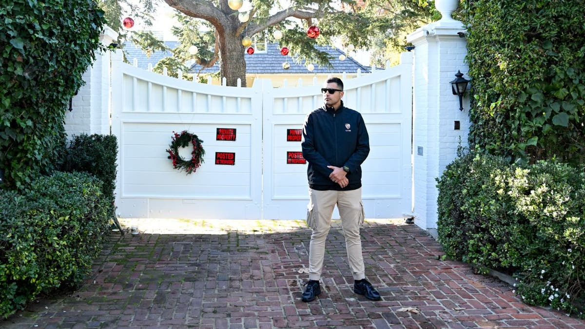 Security guard outside the Reiners’ Brentwood home.