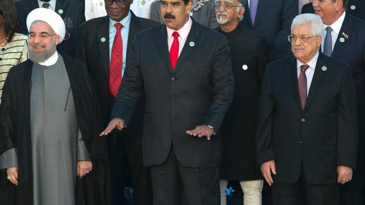 Iran's President Hassan Rouhani, from left front, Venezuela's President Nicolas Maduro, and Palestinian President Mahmoud Abbas, gather for the official group photo at the 17th Non-Aligned Movement Summit in Porlamar, on Venezuela's Margarita Island, Saturday, Sept. 17, 2016. (AP Photo/Ariana Cubillos)