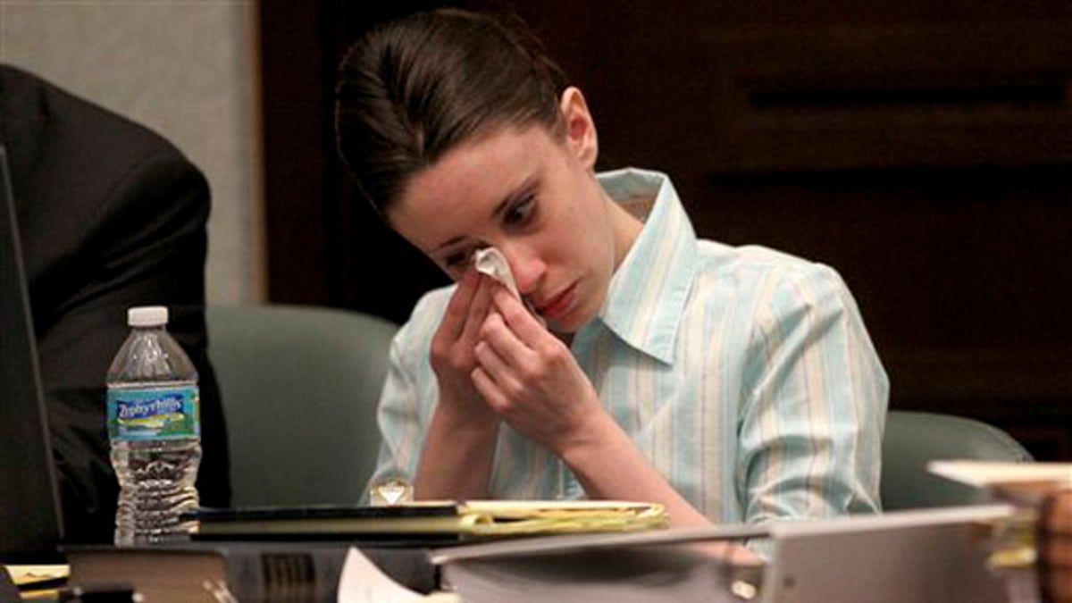 Casey Anthony reacts during her trial at the Orange County Courthouse, Thursday, May 26, 2011, in Orlando, Fla. Anthony is charged with murder in the 2008 death of her daughter Caylee. (AP Photo/Red Huber, Pool)