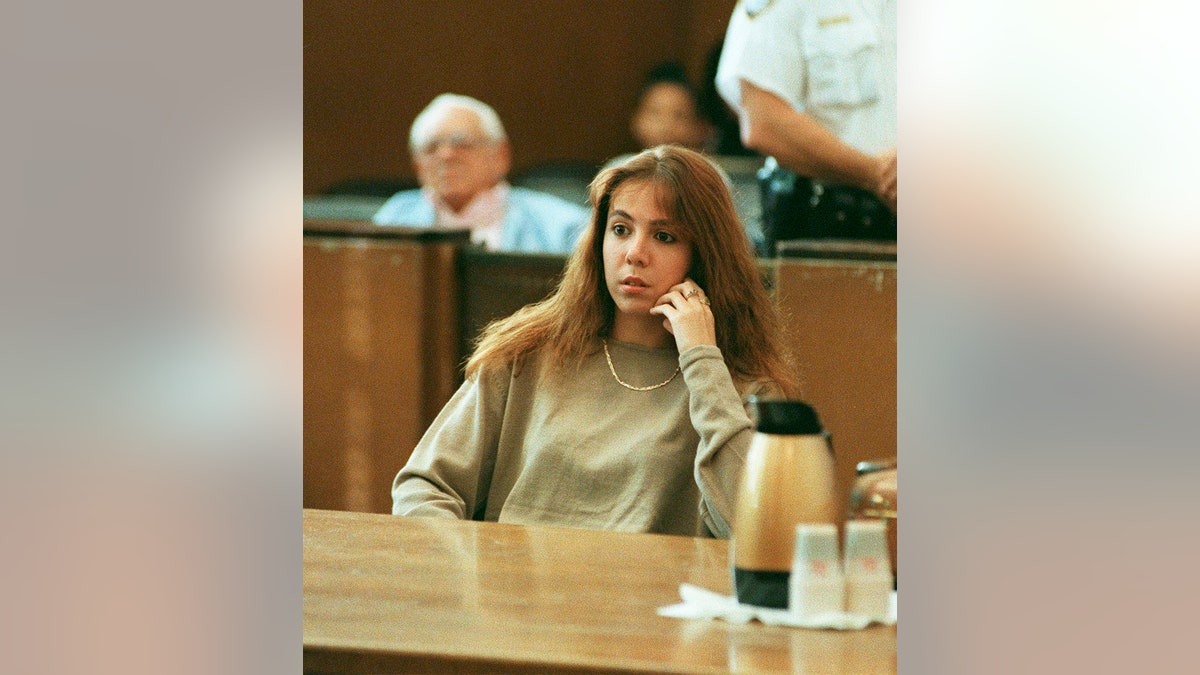 Amy Fisher sitting in a court room.
