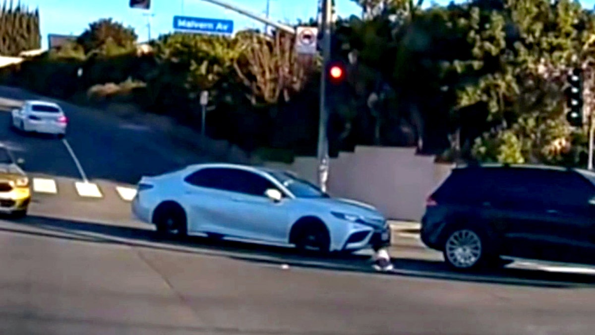 car stops before collision with child and SUV