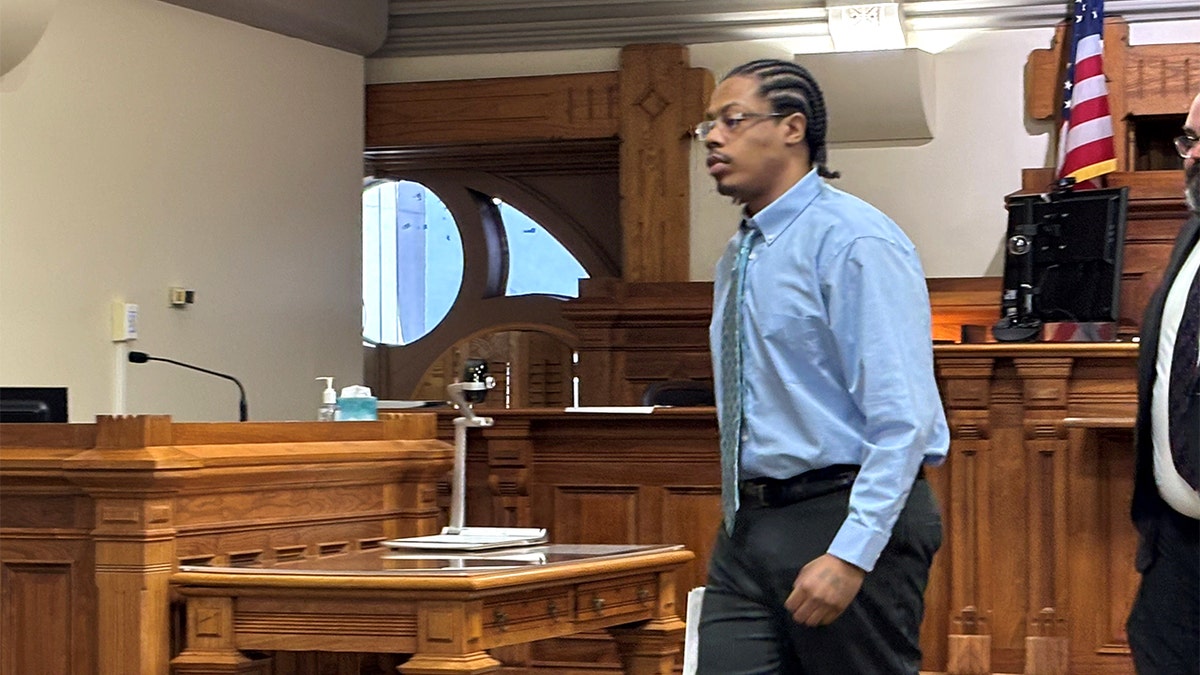 Deonta Johnson walks to his seat