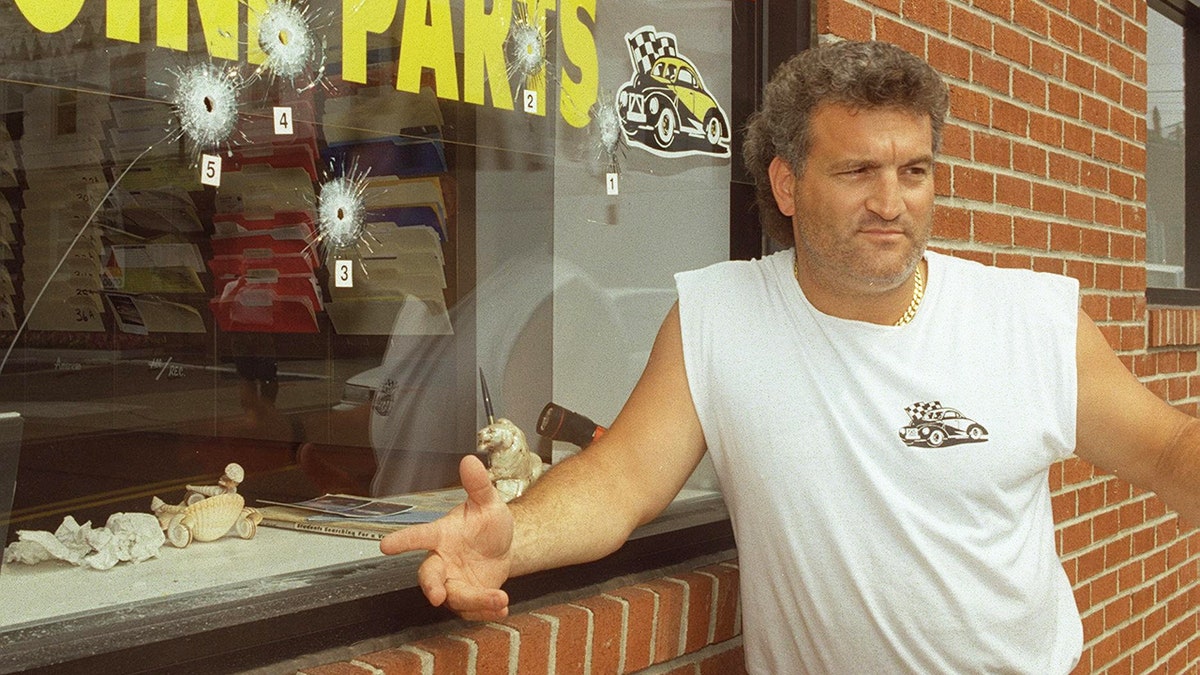 Joey Buttafuoco standing in front of his auto body shop.