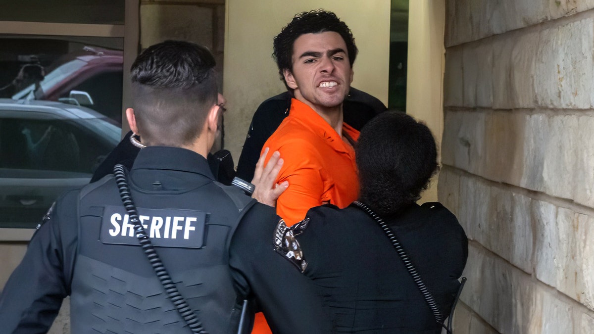 Luigi Mangione shouts at a Pennsylvania courthouse