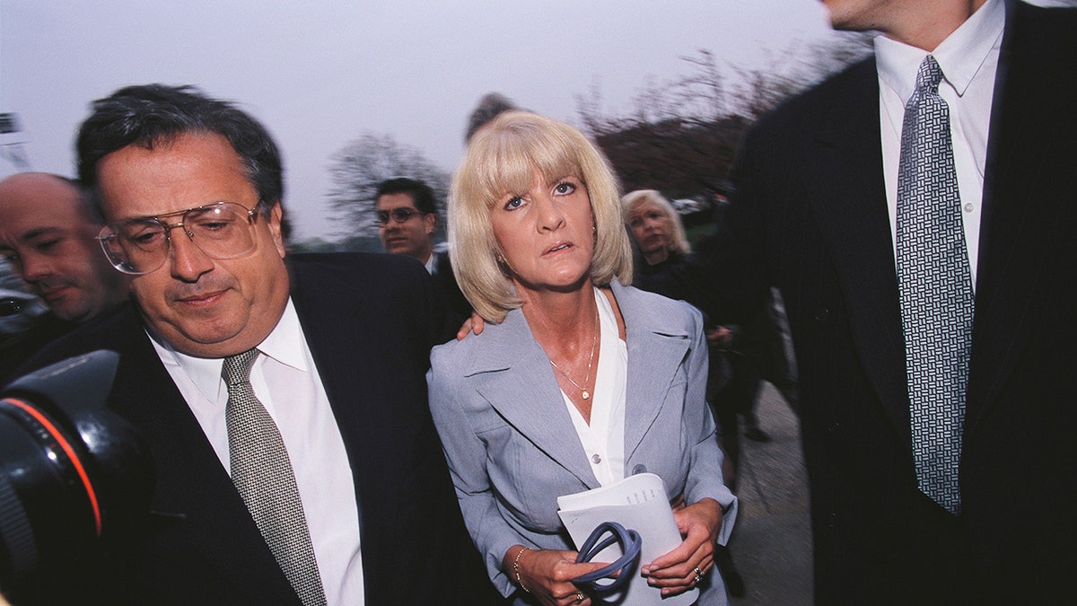 Mary Jo Buttafuoco accompanied by lawyers heading to court.