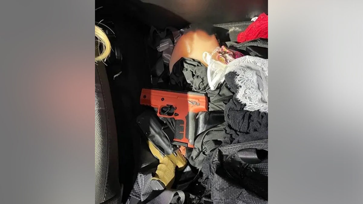 gun found under prosthetic silicone breast