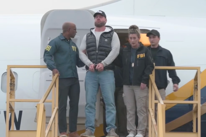 Ex-Olympian Ryan Wedding arrives in US, escorted off plane in cuffs by FBI after Mexico capture