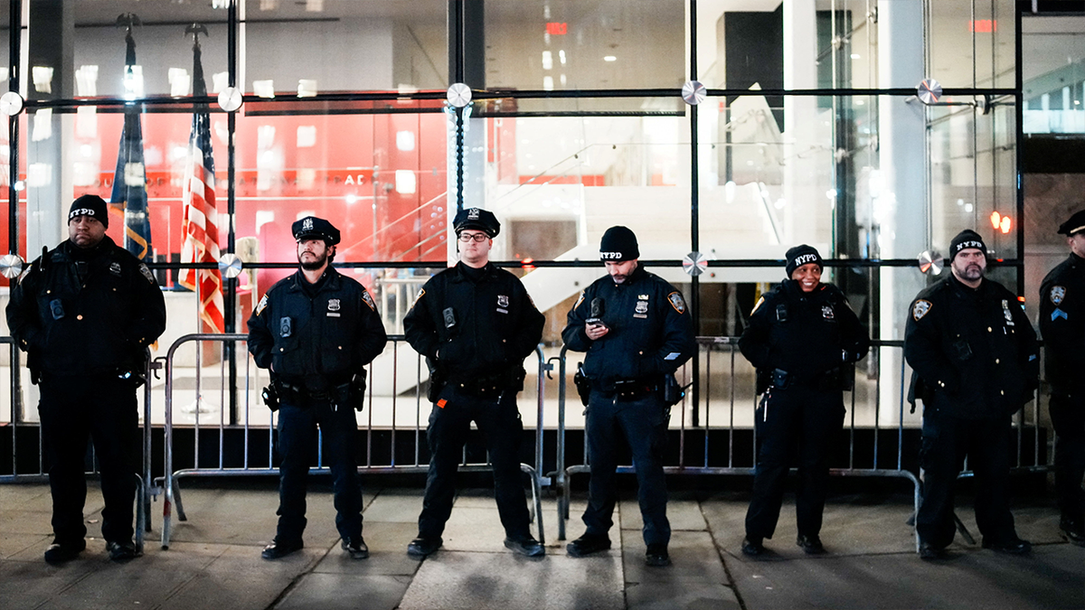 Police stand guard outside the federal building in NYC