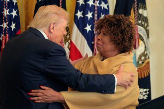 Grandmother urges voters to abandon party loyalty after defending Trump at Black History Month event