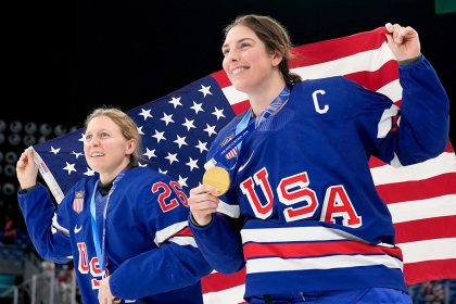 USA women’s hockey sings national anthem arm in arm after Olympic gold medal win: ‘The best part’