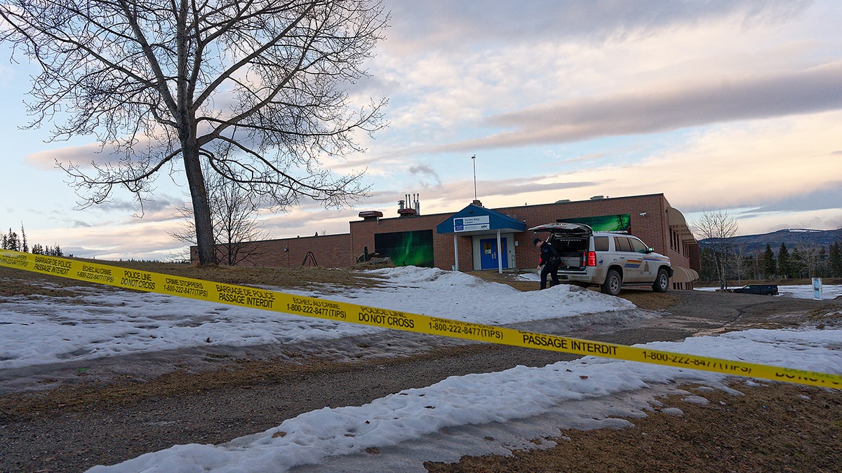 Police tape surrounds the Tumbler Ridge Secondary School and other buildings in Tumbler Ridge, B.C. on Wednesday, Feb. 11, 2026. (Jesse Boily /The Canadian Press via AP)