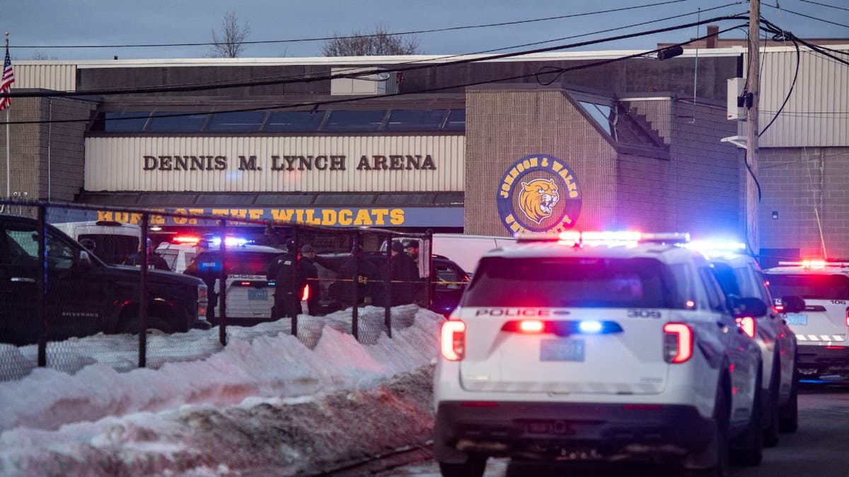 Police cars with flashing lights outside Dennis M. Lynch Arena in Pawtucket, Rhode Island after a shooting.