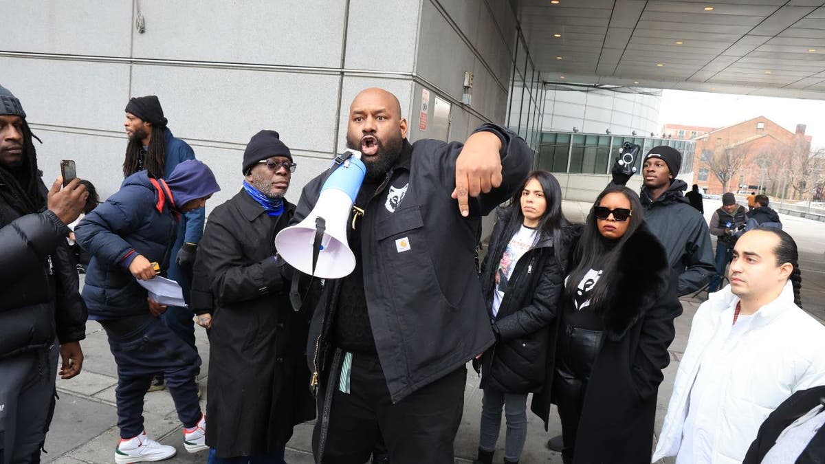 Activists protest outside Bronx court after arraignment of NYPD Sgt. Erik Duran.