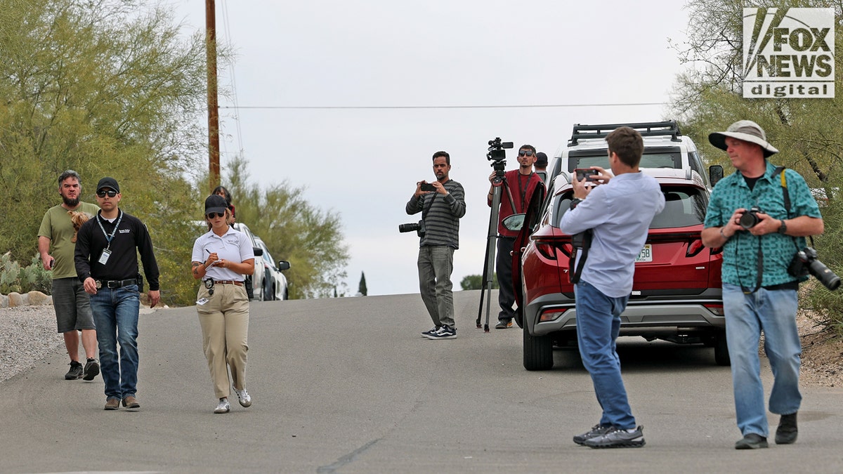 Press taking photos of law enforcement