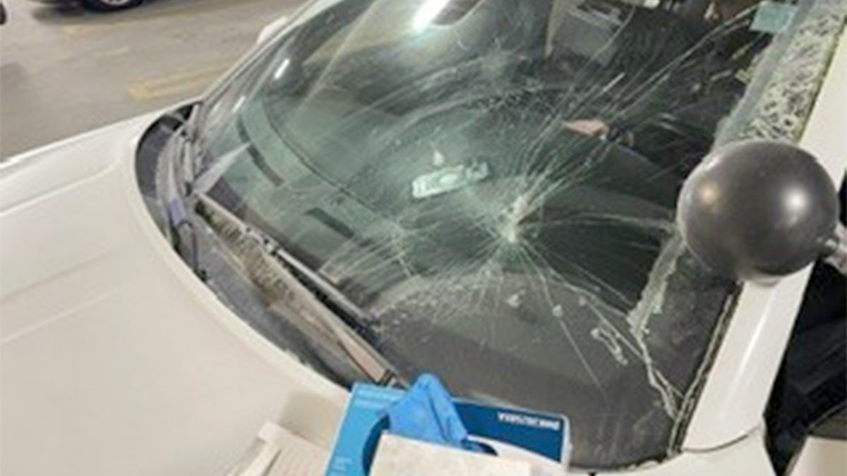 Front window smashed from patrol vehicle.