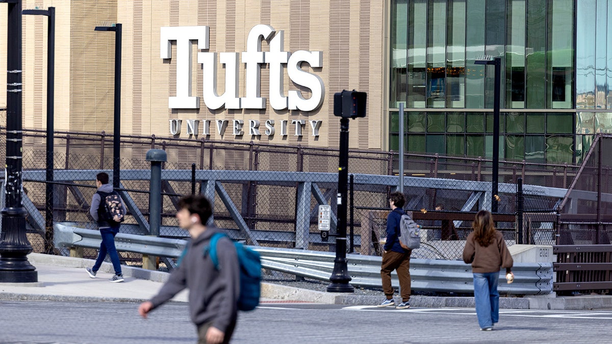 People walk near Tufts University in Massachusetts.