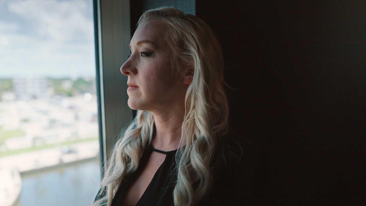 Mila Montanez looking toward the window.