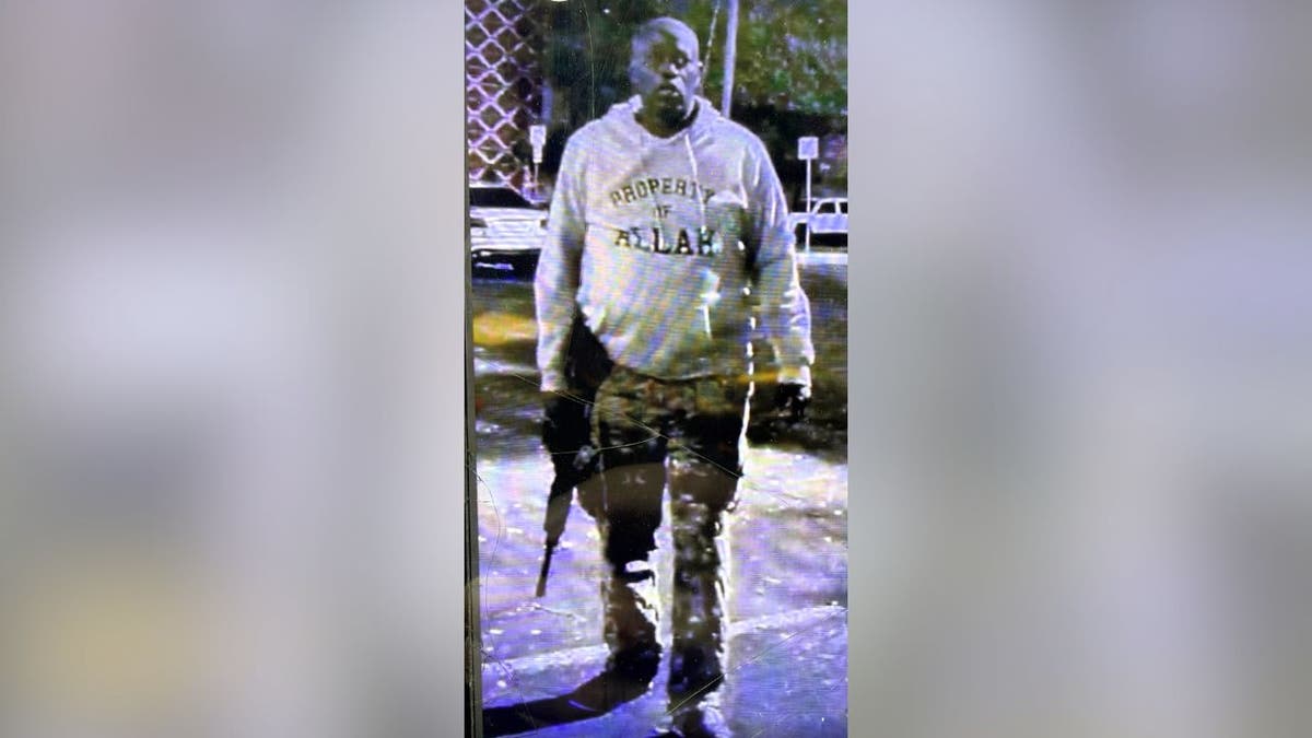 Austin shooting suspect wearing hoodie referencing Allah and carrying rifle
