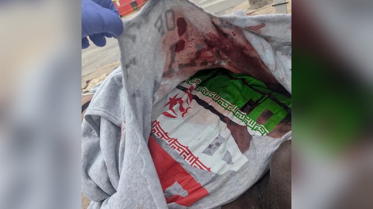 Austin bar shooter's shirt with Iran flag.